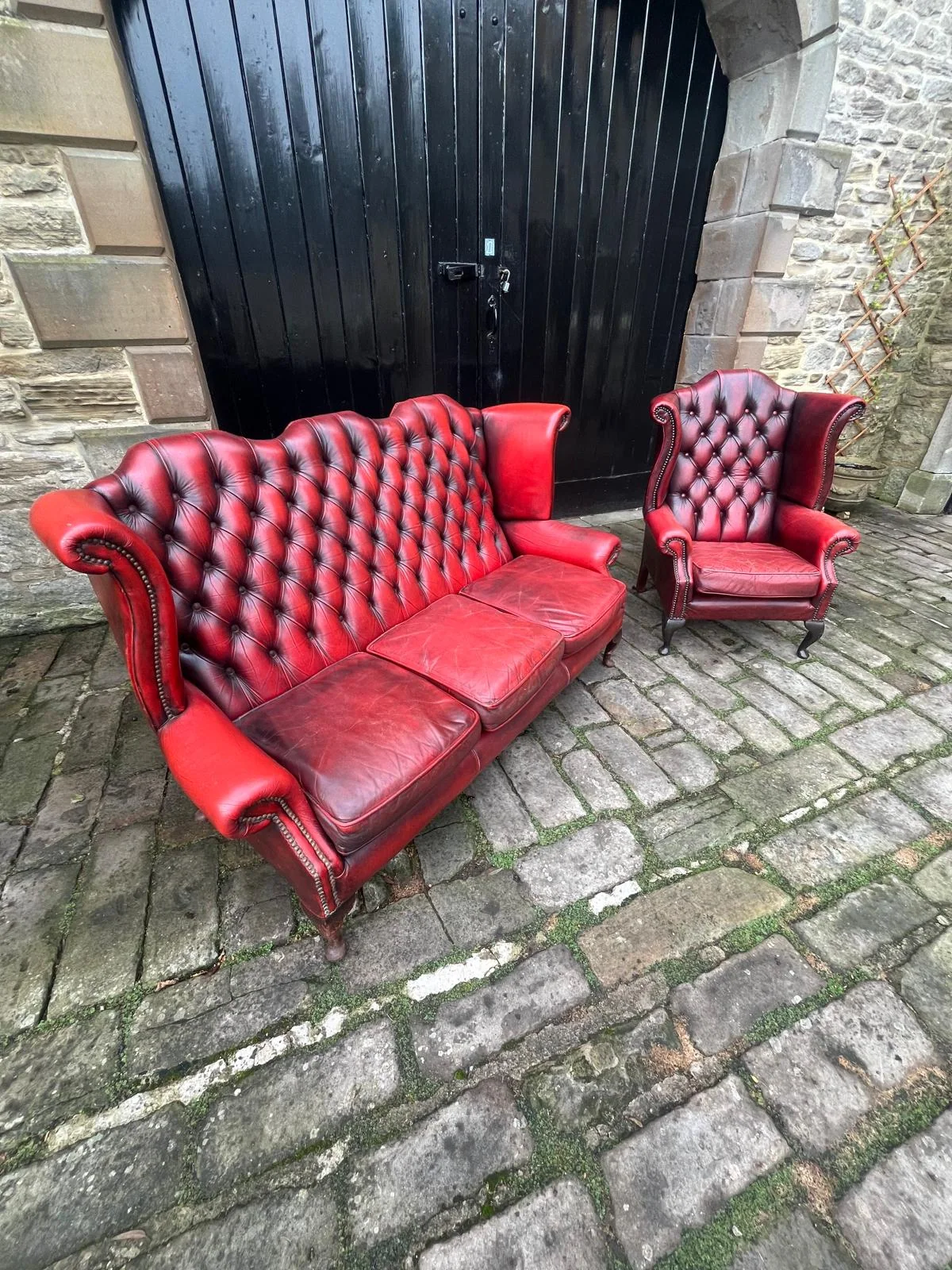 Red leather Chesterfield sofa and matching chair